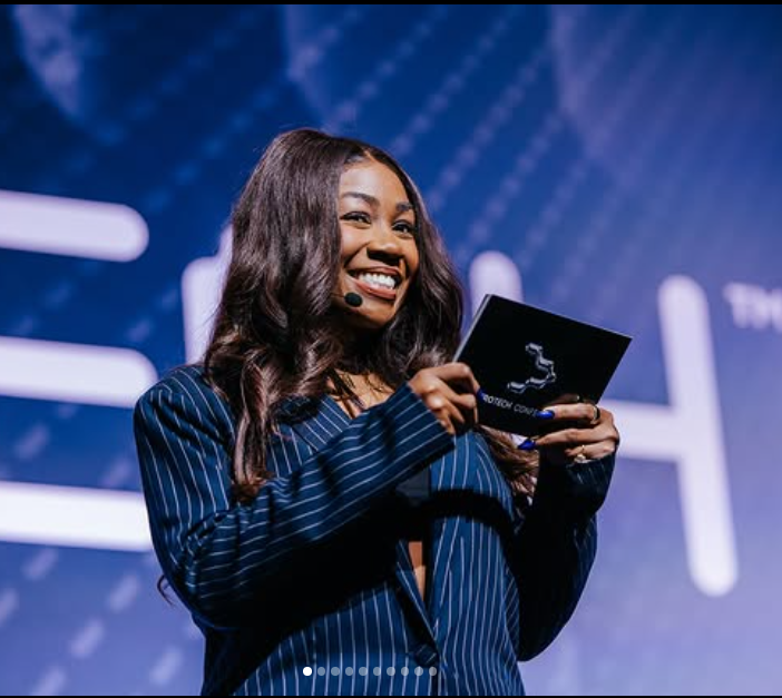 Sequoia B. Holmes speaking on stage