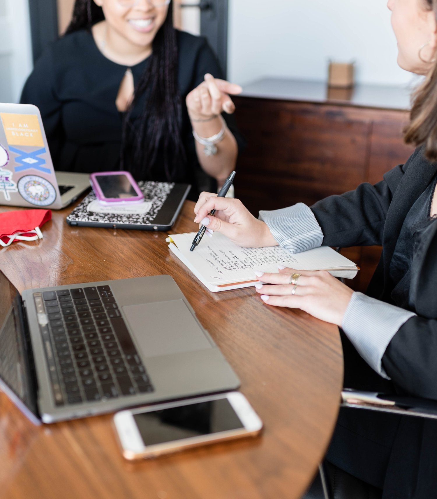Two women meeting around a laptop